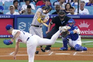 Pittsburgh Pirates' Bryan Reynolds, second from left, hits a solo home run as Los Angeles Dodgers starting pitcher Bobby Miller, left, and catcher Will Smith, right, watch long with home plate umpire Clint Vondrak during the first inning of a baseball game Wednesday, July 5, 2023, in Los Angeles. (AP Photo/Mark J. Terrill)