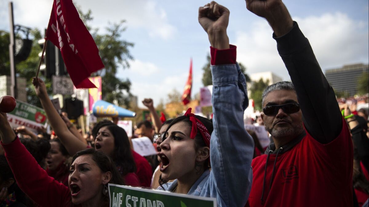 Educators, students and supporters rally on the fifth day of the LAUSD teachers' strike at Grand Park in Los Angeles on Jan. 18.