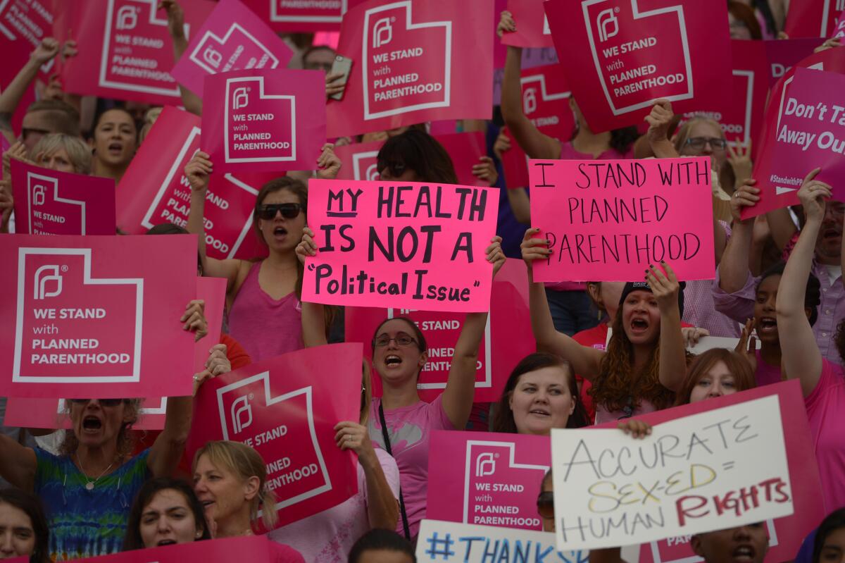 Supporters of Planned Parenthood rallied last month in Salt Lake City, where Utah Gov. Gary Herbert is aiming to stop disbursing federal money to the women's health organization.