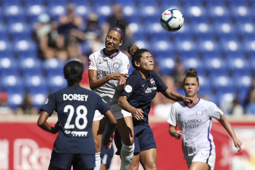 Orlando Pride midfielder Kristen Edmonds (12) and Sky Blue FC midfielder Raquel Rodriguez (11) jump up to head the ball during the first half of an NWSL soccer match, Sunday, Sept. 29, 2019, in Harrison, N.J. The match ended in a 1-1 draw. (AP Photo/Steve Luciano)