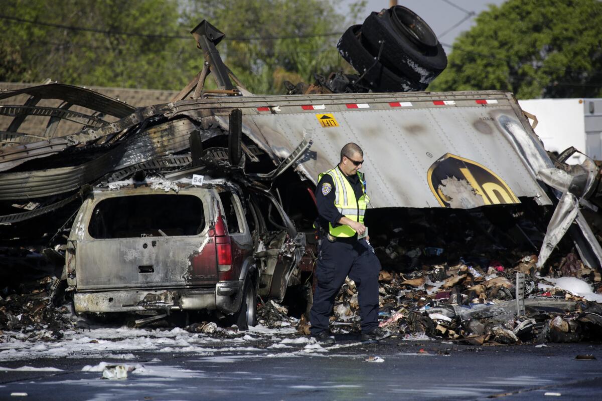 California Highway Patrol officials investigate at a fiery crash in Commerce in 2016 that left three people dead. Street racing was believed to be a factor, and a man is awaiting trial on murder charges in connection with the crash.