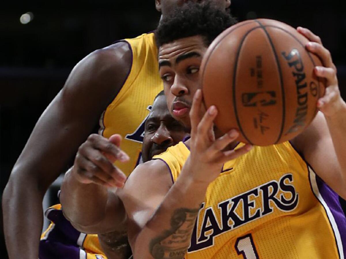 Lakers guard D'Angelo Russell dribbles past Mavericks guard Raynond Felton during a game at Staples Center on Jan. 26.