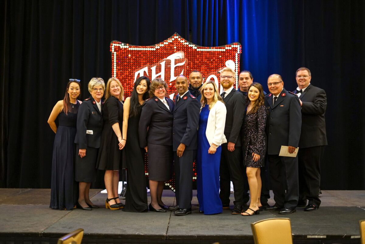 The Salvation Army Orange County team smiles for a photo after a successful evening at "A Night For Others."
