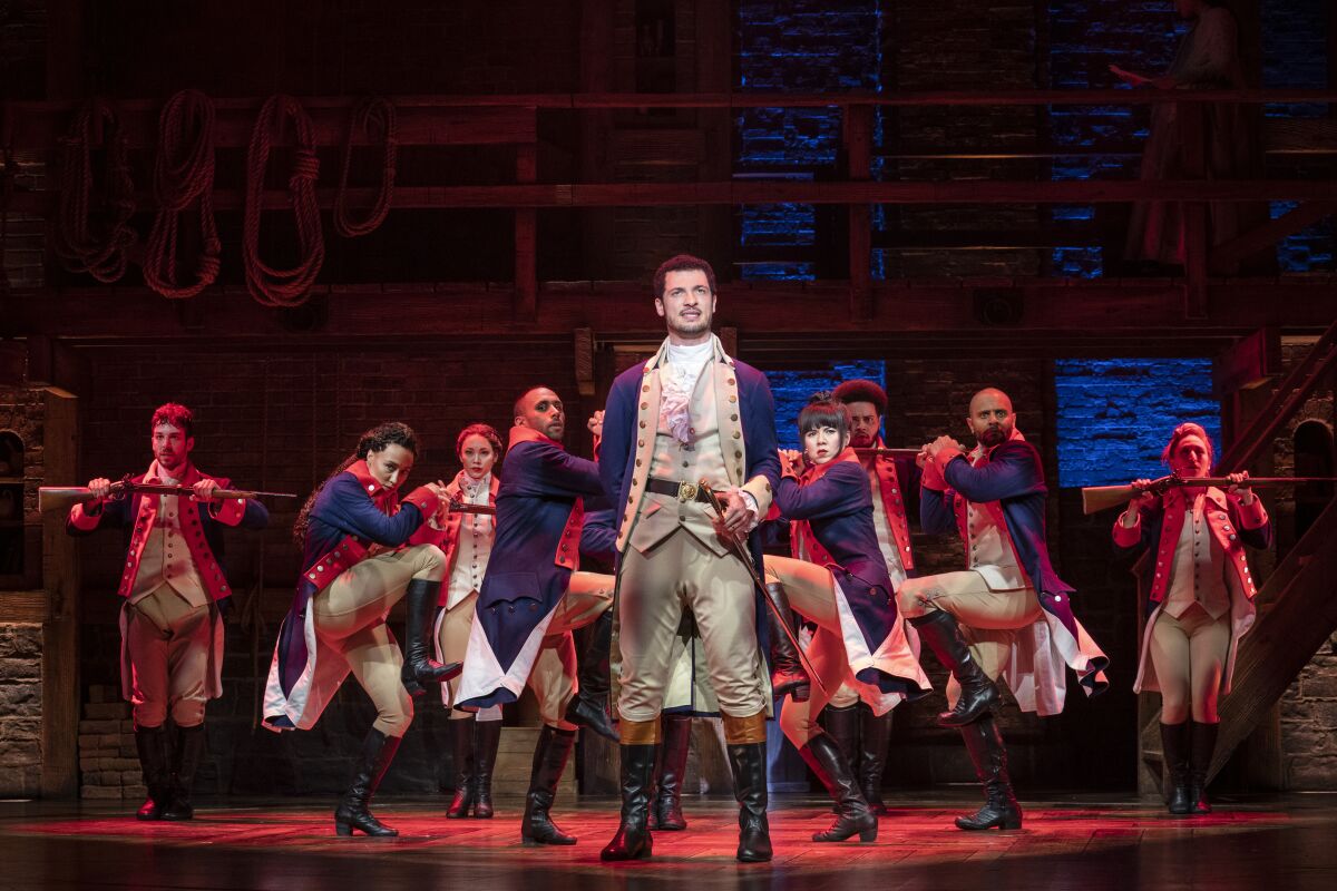 Jamael Westman, as Alexander Hamilton, stands center stage in a scene from "Hamilton"