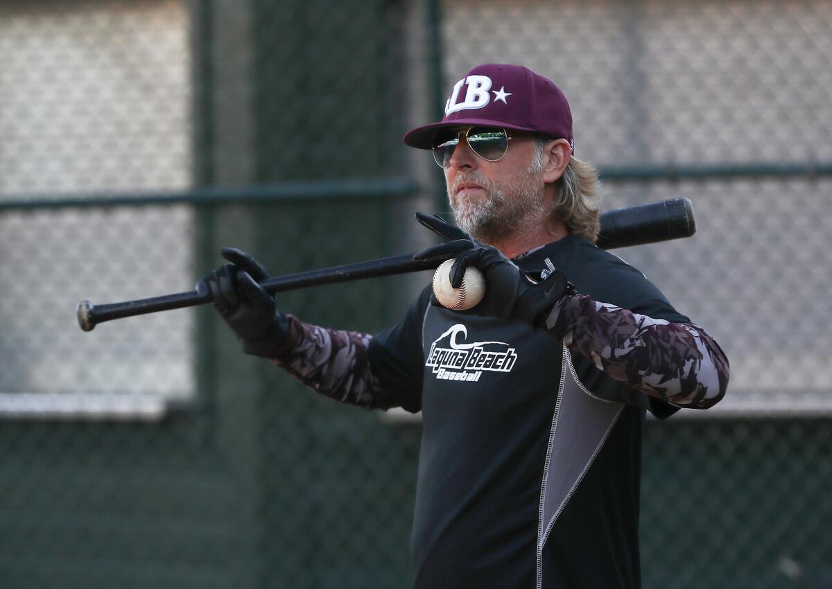 Coach Rob Engstrom runs drills as the Laguna Beach Little League Intermediate All-Stars practice on Tuesday at Riddle Field.