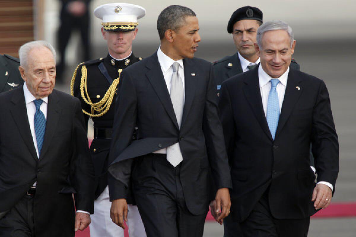 Israeli President Shimon Peres, left, President Obama and Israeli Prime Minister Benjamin Netanyahu walk together prior to Obama's departure from Ben Gurion International Airport on Friday.
