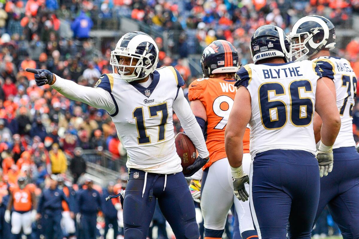 Rams receiver Robert Woods indicates a first down against the Denver Broncos during the second half on Sunday.