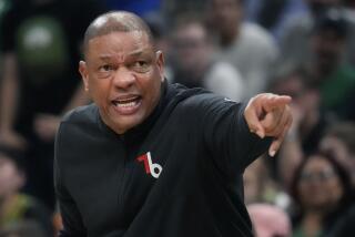 Philadelphia 76ers coach Doc Rivers calls to players during the first half of Game 5 of the team's NBA basketball Eastern Conference semifinal playoff series against the Boston Celtics on Tuesday, May 9, 2023, in Boston. (AP Photo/Charles Krupa)