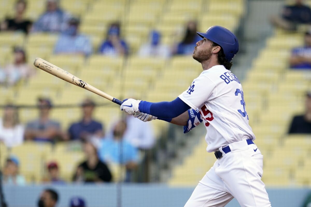 Los Angeles Dodgers' Cody Bellinger follows through on his grand slam during the first inning of a baseball game against the St. Louis Cardinals Wednesday, June 2, 2021, in Los Angeles. (AP Photo/Marcio Jose Sanchez)