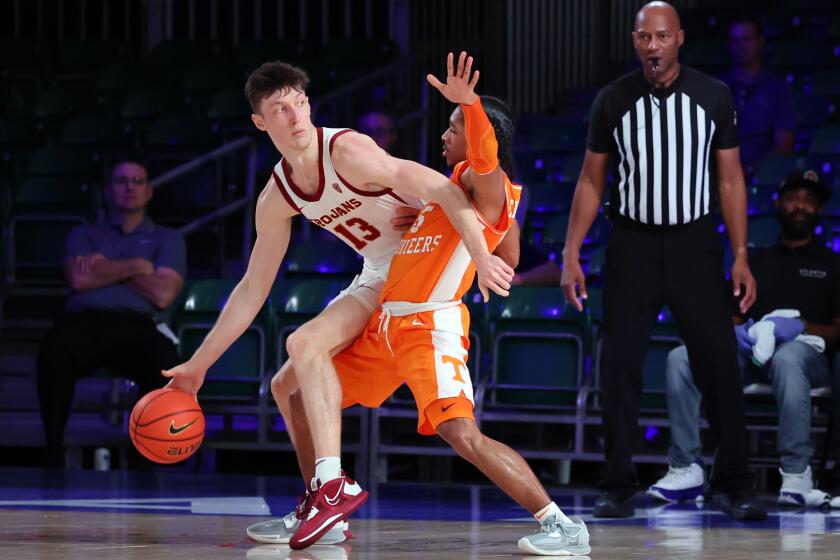 In a photo provided by Bahamas Visual Services, Southern California's Drew Peterson (13) works against Tennessee's Tyreke Key (5) during an NCAA college basketball game in the Battle 4 Atlantis at Paradise Island, Bahamas, Thursday, Nov. 24, 2022. (Tim Aylen/Bahamas Visual Services via AP)