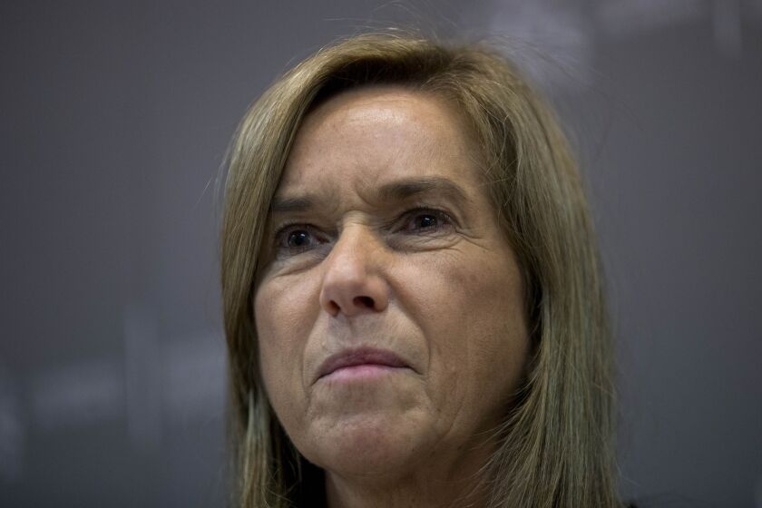 Spanish Health Minister Ana Mato listens to a question during a news conference Oct. 6 in Madrid. A Spanish nurse who treated two priests for Ebola at a hospital there has tested positive for the virus.