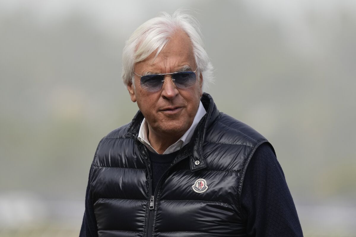 FILE - Trainer Bob Baffert waits for the Breeders' Cup horse races at Del Mar racetrack in Del Mar, Calif., on Nov. 5, 2021. Baffert can once again enter horses at New York’s major tracks. The Hall of Fame trainer’s one-year ban by the New York Racing Association ended Wednesday, Jan. 25, 2023, allowing him to enter horses as soon as Thursday, Jan. 26. (AP Photo/Jae C. Hong, File)