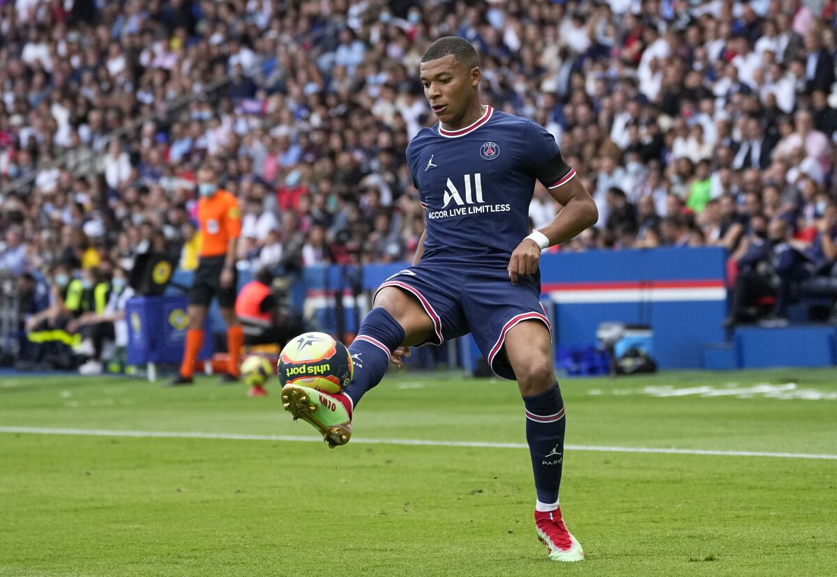 PSG's Kylian Mbappe in action during the French League One soccer match between Paris Saint-Germain and Clermont at the Parc des Princes stadium in Paris, France, Saturday, Sept. 11, 2021. (AP Photo/Michel Euler)