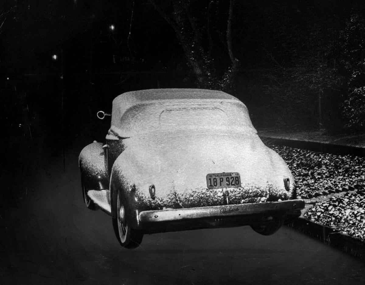 Jan. 9, 1949: An automobile parked near the Rose Bowl at Linda Vista Avenue and Lida Street sits covered with snow.