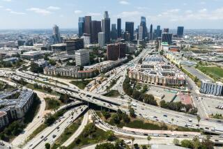LOS ANGELES, CA - JUNE 23: Los Angeles skyline and the four-level interchange where the 110 and 101 freeways meet. Photographed in Los Angeles, CA on Friday, June 23, 2023. (Myung J. Chun / Los Angeles Times)