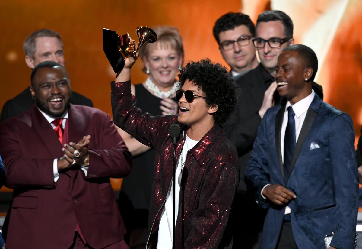 Bruno Mars accepting the album of the year prize.