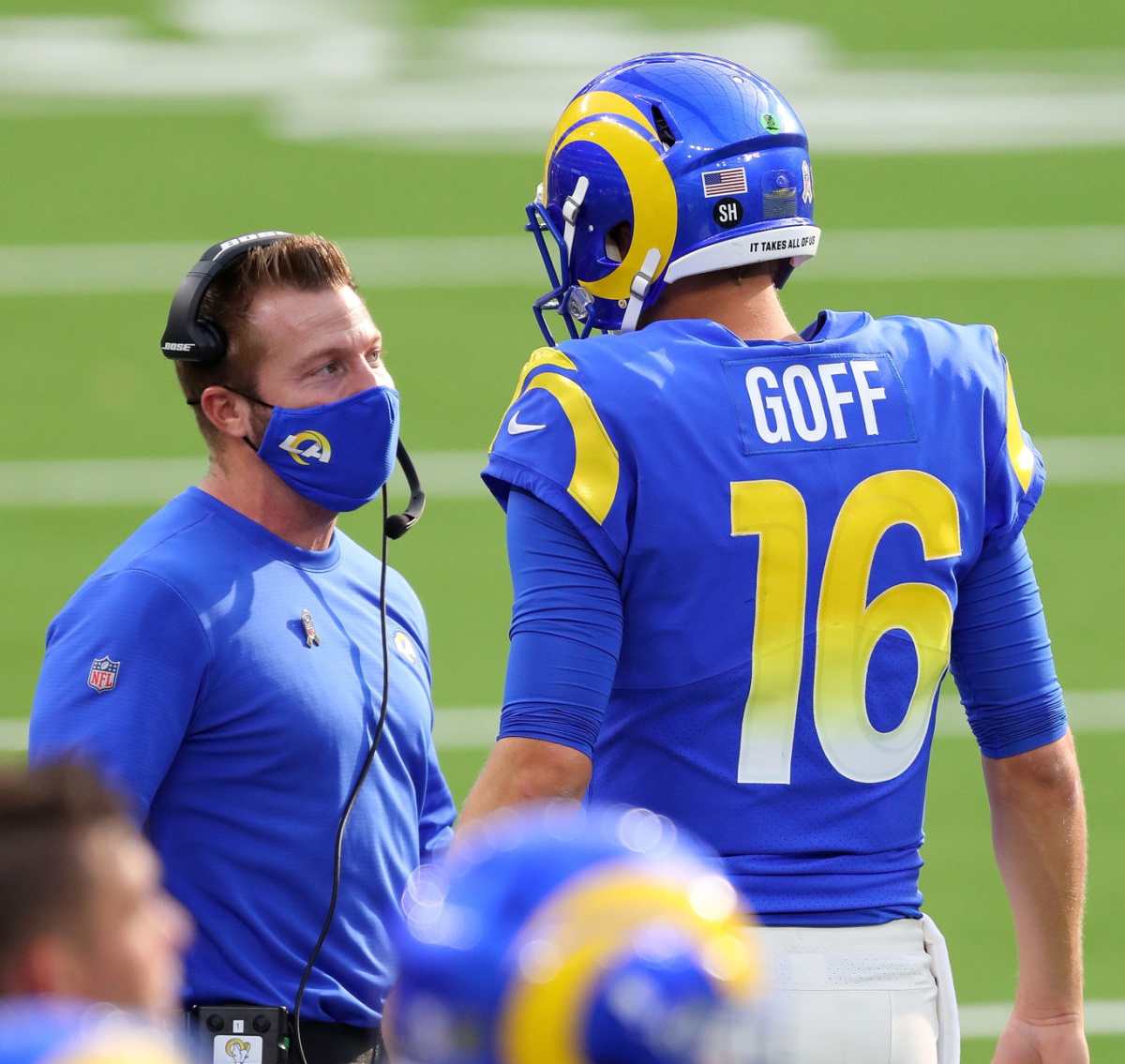 Rams coach Sean McVay speaks with quarterback Jared Goff on the sideline.