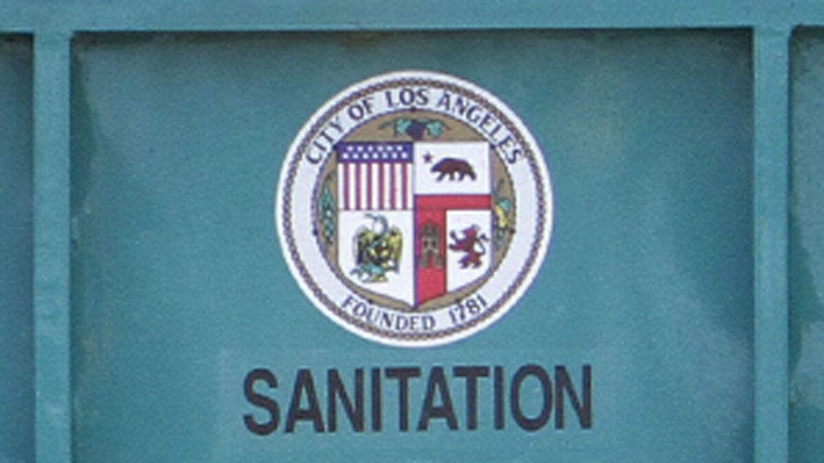 The city seal on the back of a Bureau of Sanitation truck.