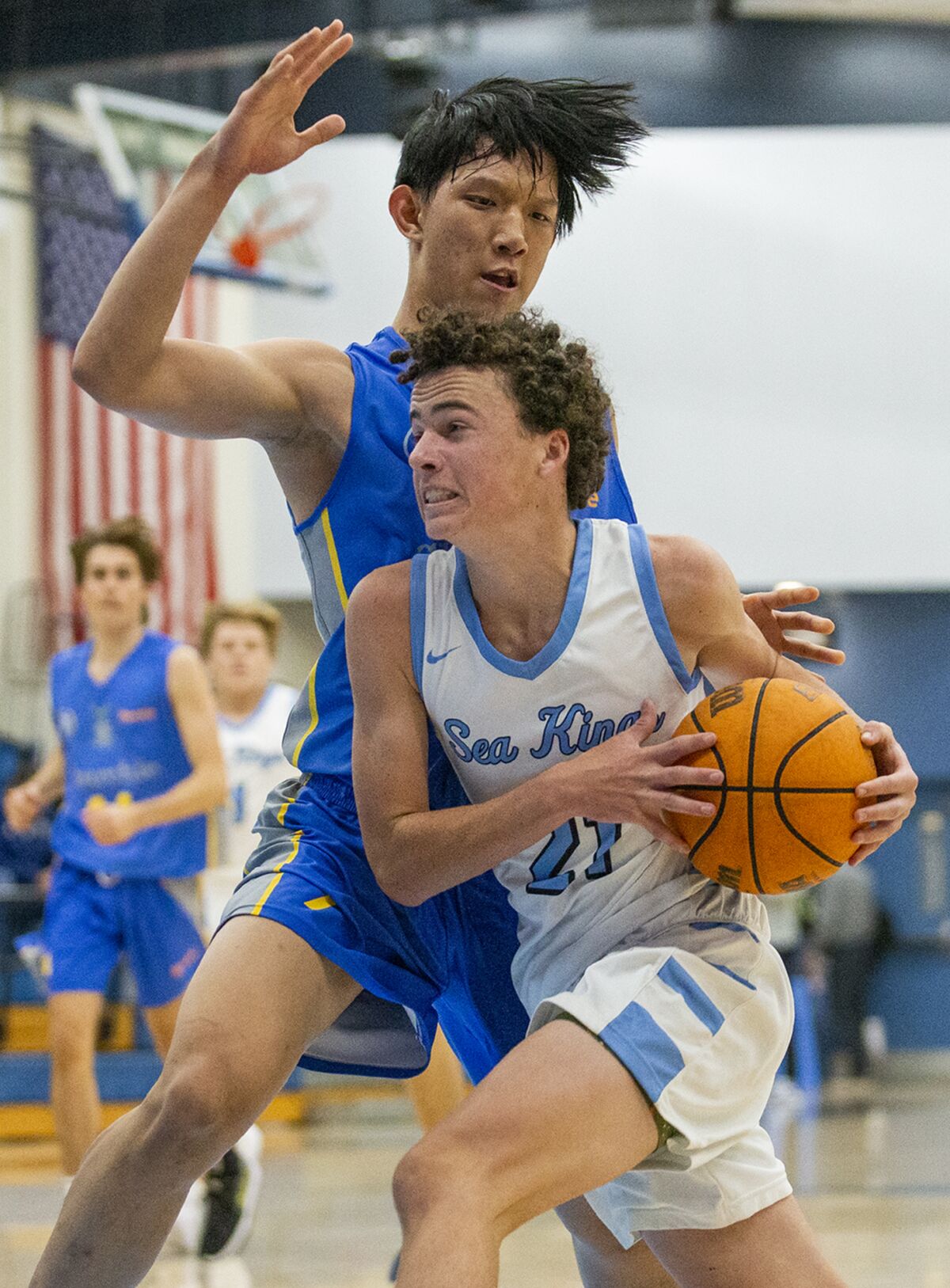 Corona del Mar's Everett Welton drives to the hoop against a Churchie defender during the CdM Beach Bash on Wednesday.
