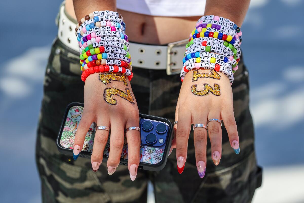 Wrists filled with friendship bracelets