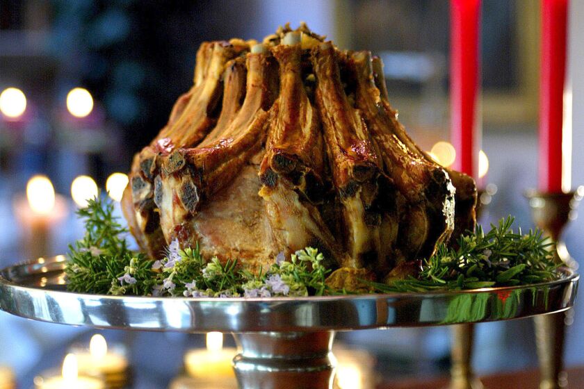 Crown roast of pork stuffed with wild rice and dried fruit. Recipe here.