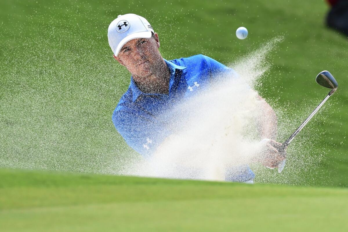 Jordan Spieth chips from the bunker Sunday on the ninth hole during the final round of the Australian Open.