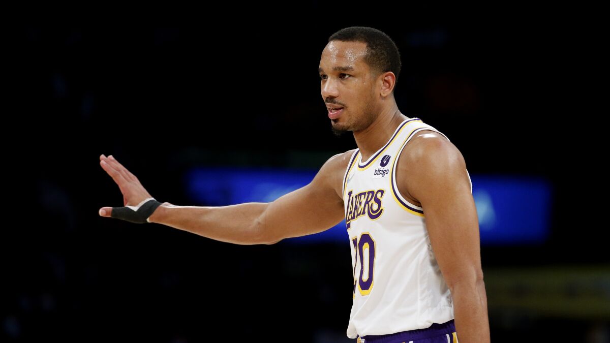 Avery Bradley played well in a win over Atlanta the same day the Lakers picked up his contract for the rest of the season.