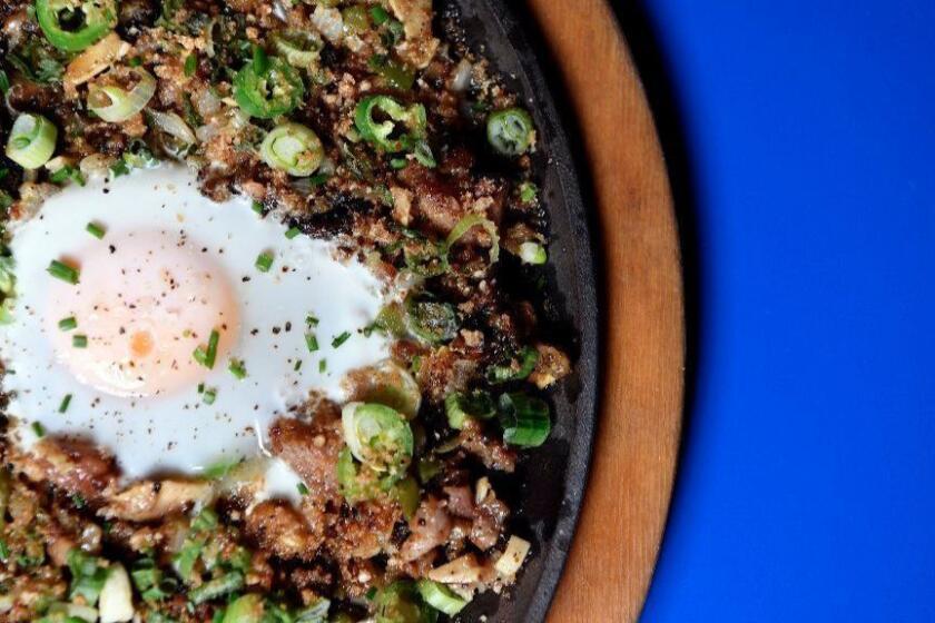 LOS ANGELES, CA-January 14,2019: Inside the Ma'am Sir on Monday, January 14, 2019. The Pork Sisig (with egg): Sweetbreads, Maui Onions, Serrano Chile, Green Onion, Calamansi.(Mariah Tauger / Los Angeles Times)