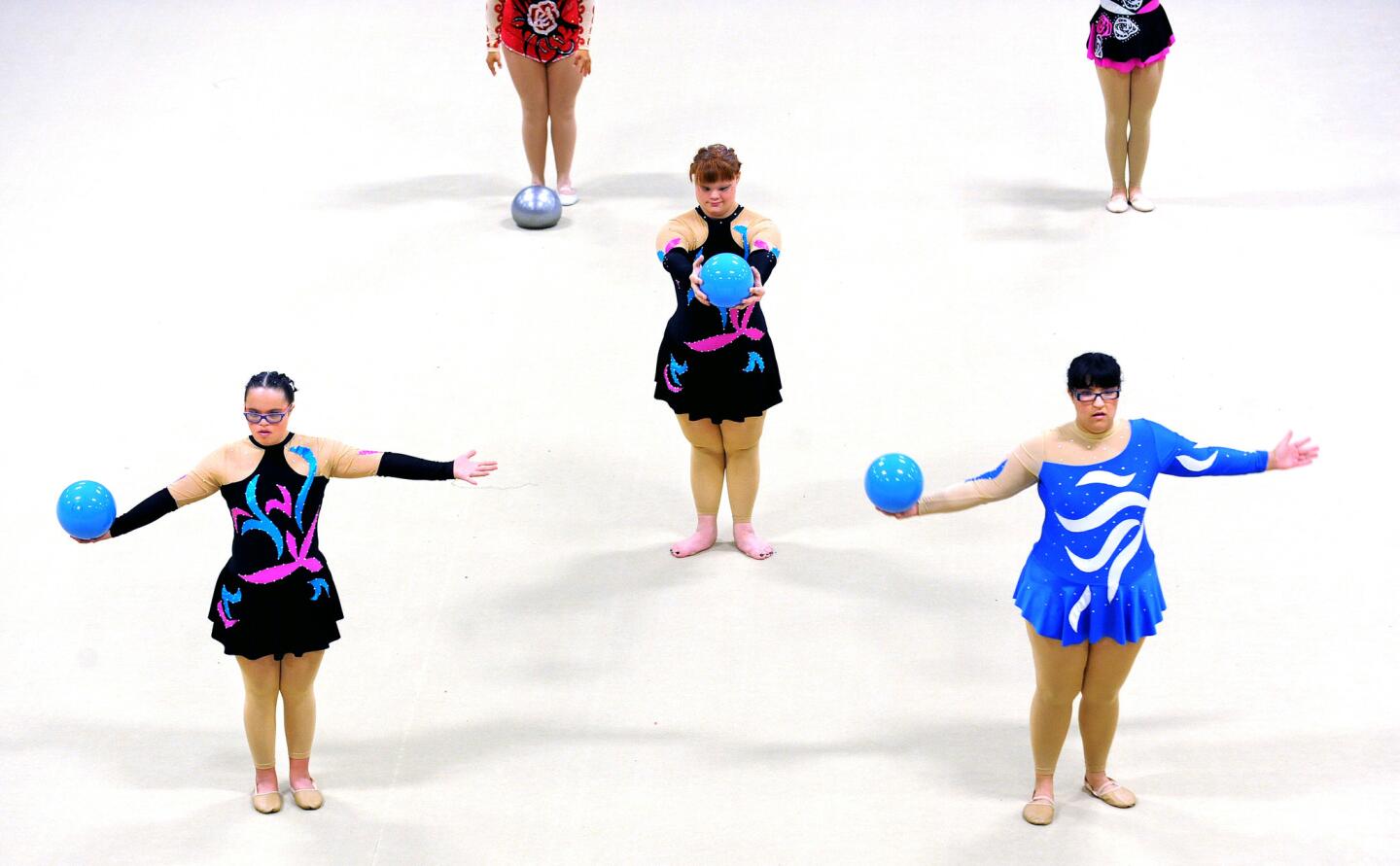 Athletes warm up before competing in the rhythmic gymnastics of the Special Olympics at UCLA on Monday.