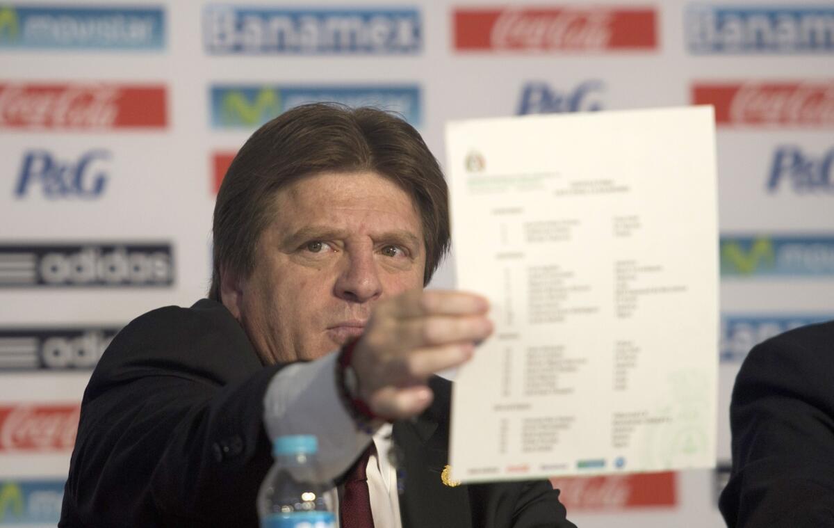 Mexico Coach Miguel Herrera shows off his World Cup roster.