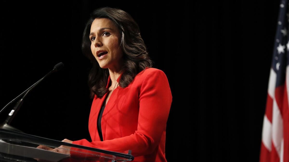 Tulsi Gabbard, the first Hindu elected to Congress, served in the National Guard in the Mideast but is a critic of U.S. foreign policy.