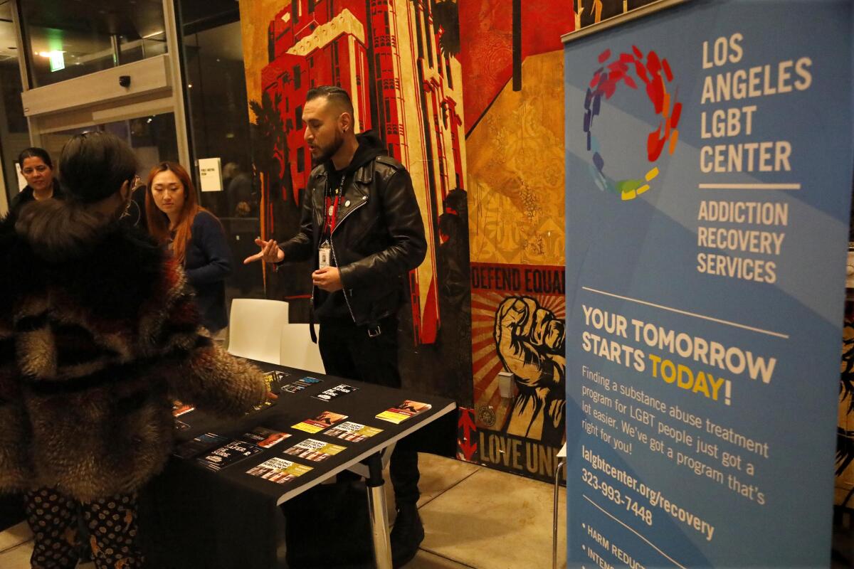 Eric Fletes, an outreach specialist with the Los Angeles LGBT Center, shares information about fentanyl and substance abuse treatment with the public at a "chemsex" town hall meeting in West Hollywood.