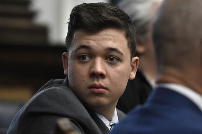 Kyle Rittenhouse looks back as attorneys discuss items in the motion for mistrial presented by his defense at the Kenosha County Courthouse in Kenosha, Wis., on Wednesday, Nov. 17, 2021. (Sean Krajacic/The Kenosha News via AP, Pool)