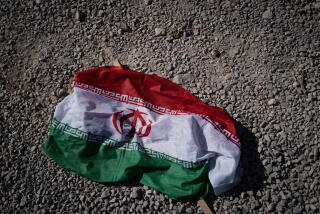 An Iranian flag on the ground