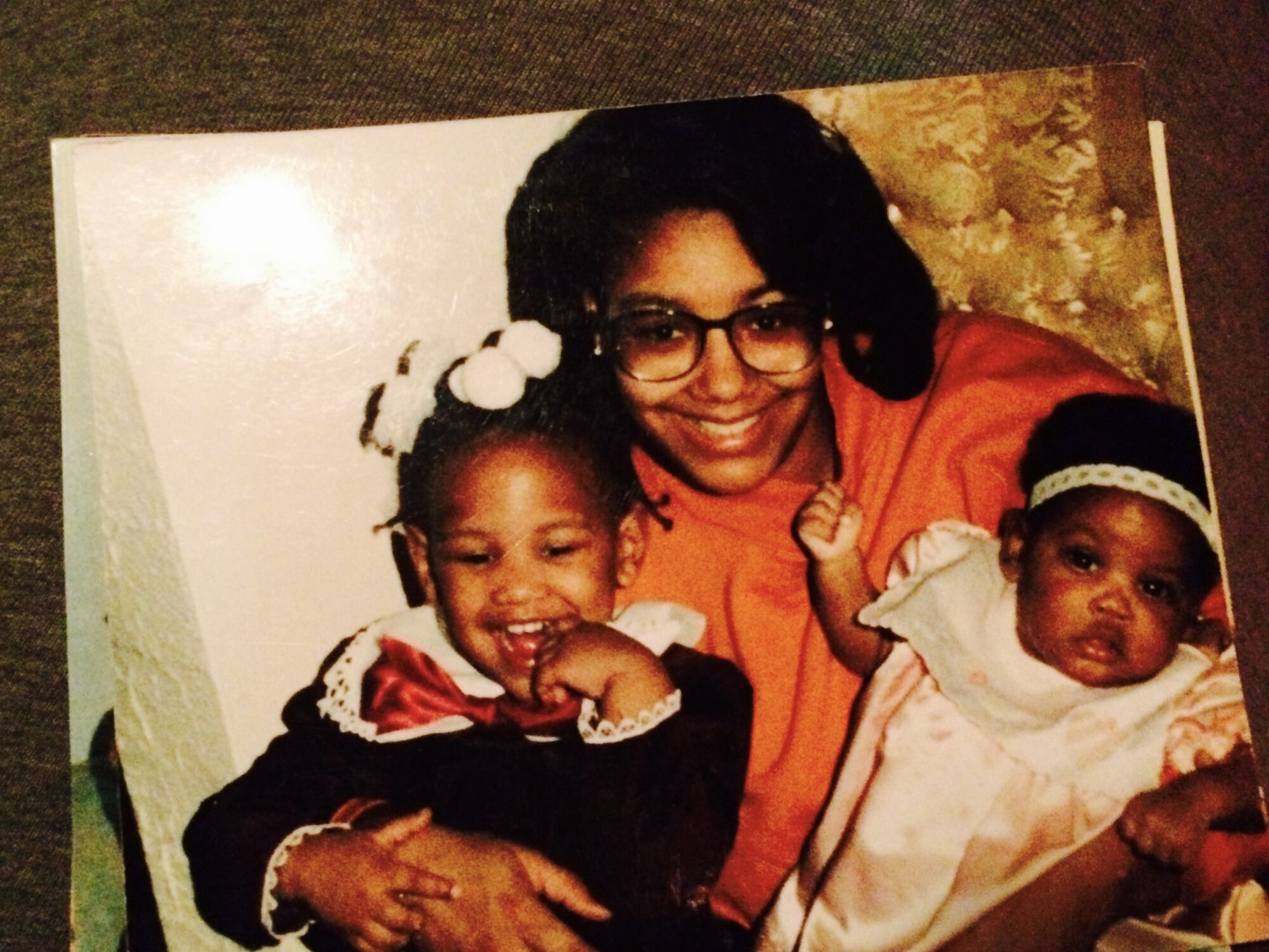 Wanda Mathis-Conner, or "Ma," holds daughters Riann, left, and Raven