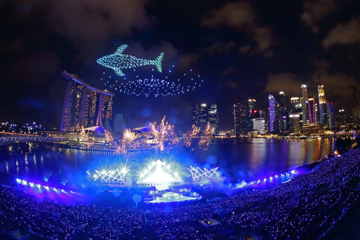 Drones form the shape of a whale as Singapore awaits the countdown celebration.