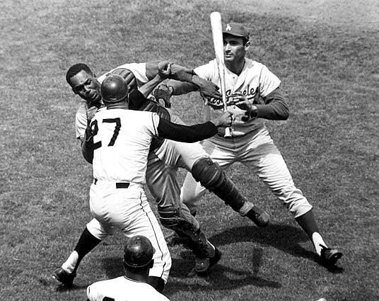 One of the ugliest Dodgers-Giants confrontations ever was when the Giants' Juan Marichal attacked catcher John Roseboro with a bat during a game at Candlestick Park. Marichal accused Roseboro of throwing a ball too close to his head. Sandy Koufax, the pitcher that day, came to his catcher's defense.