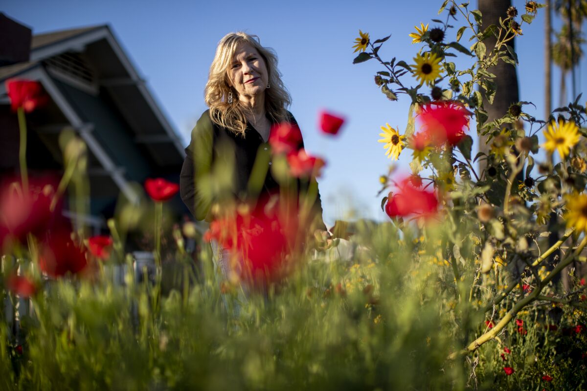 RIVERSIDE, CA - MARCH 12, 2022: Author Susan Straight in front of her home.