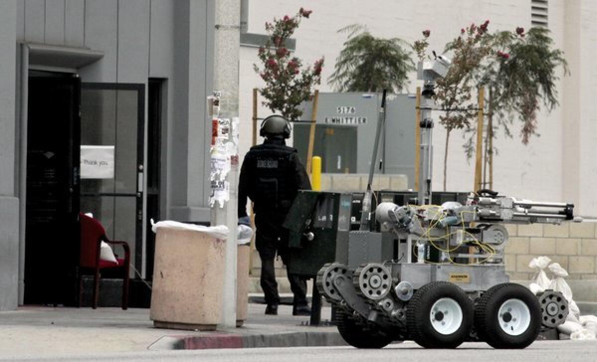 A robot and bomb squad were sent to the scene of an East L.A. bank branch where a robbery occurred.