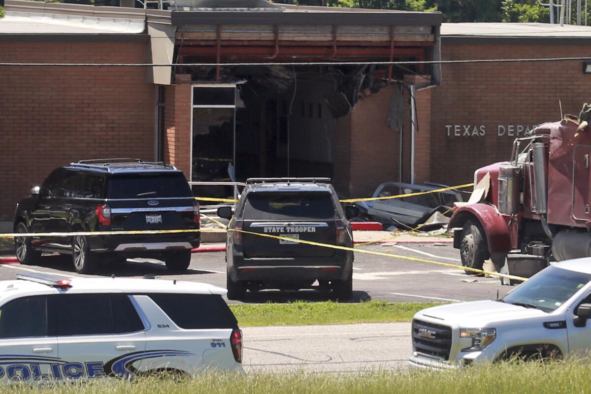 1 dead and 13 injured after semitrailer intentionally rams into Texas public safety office