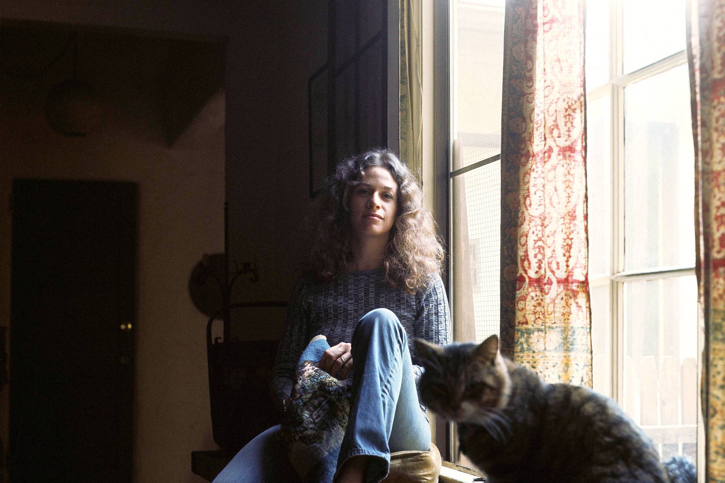 Carole King and her friend Telemachus during the photo shoot for the "Tapestry" album cover.