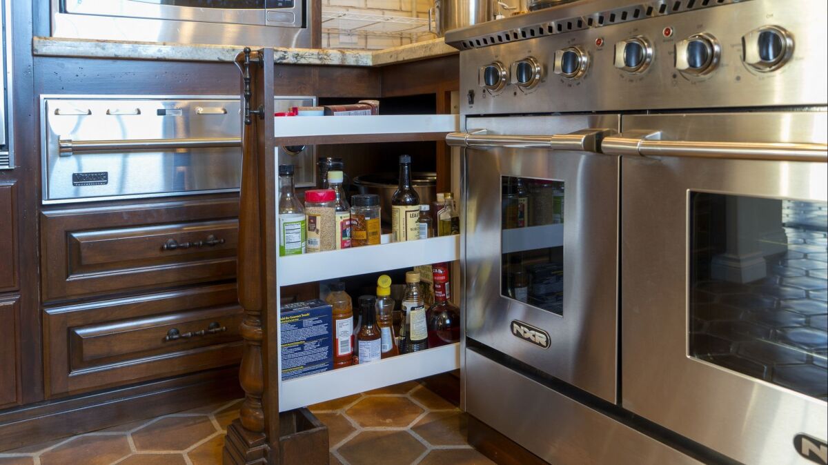 A pull-out spice rack is next to the stove in Frank Terzoli's kitchen.