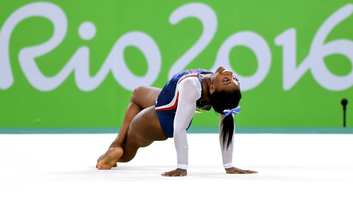 American gymnast Simone Biles performs her floor exercise during the women's all-around competition Thursday.