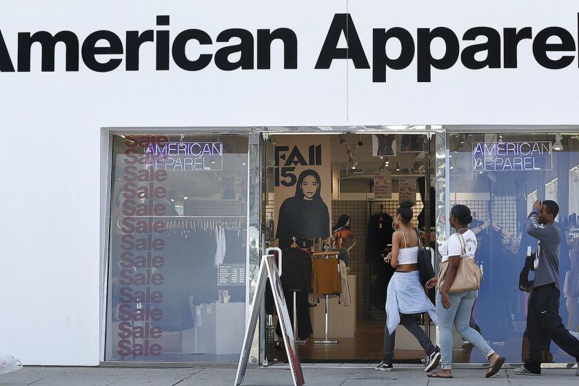 LOS ANGELES, CA-OCTOBER 5, 2015: Customers make their way into an American Apparel store on Melrose Ave. in Los Angeles on October 5, 2015. The trendy but troubled Los Angeles clothier, filed for Chapter 11 bankruptcy protection Monday. The firm said it had reached an agreement with 95% of its secured lenders to implement a financial restructuring that will drastically cut down its debts and interest payments. (Mel Melcon/Los Angeles Times)