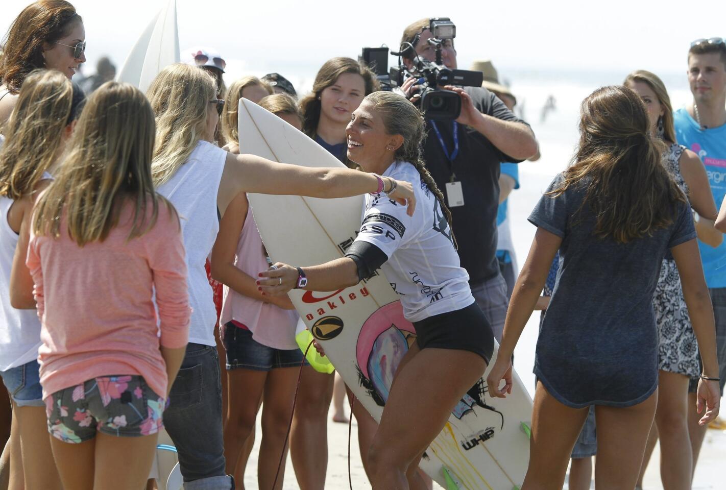 California surfer Sage Erickson is greeted by fans after her heat.