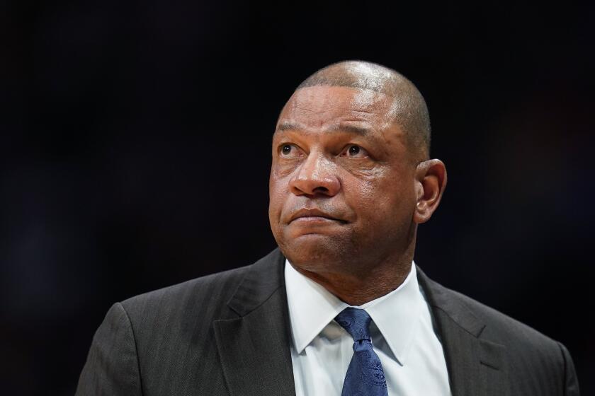 FILE - In this Jan. 12, 2020, file photo, Los Angeles Clippers coach Doc Rivers looks on during the second quarter of the team's NBA basketball game against the Denver Nuggets in Denver. The Philadelphia 76ers introduced Rivers as their head coach on Monday, Oct. 5, 2020. Rivers takes over as the 25th head coach in 76ers history after a seven-season run as head coach of the Clippers. (AP Photo/Jack Dempsey, File)