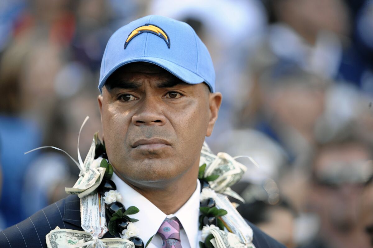 FILE - Late NFL star Junior Seau attends his induction into the San Diego Chargers Hall of Fame in San Diego on Nov. 27, 2011. The San Diego Union-Tribune reported that Seau's brother, Savaii Seau was killed in a collision with a dump truck in the the San Diego suburb of Lakeside, on Tuesday, Feb. 1, 2022. Junior Seau was found dead in 2012 from a gunshot wound to his chest. (AP Photo/Denis Poroy, file)