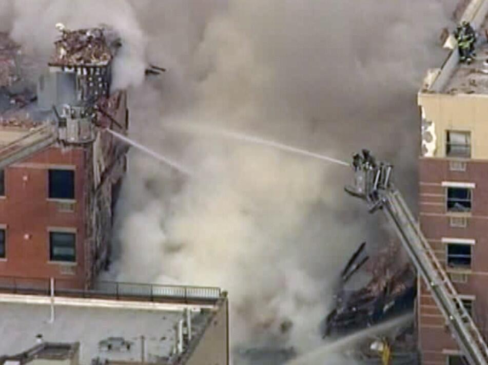 In this image taken from video from WABC, firefighters battle a blaze at the site of a possible explosion and building collapse in the East Harlem neighborhood of New York, Wednesday, March 12, 2014. (AP Photo/WABC-TV) ** Usable by LA and DC Only **