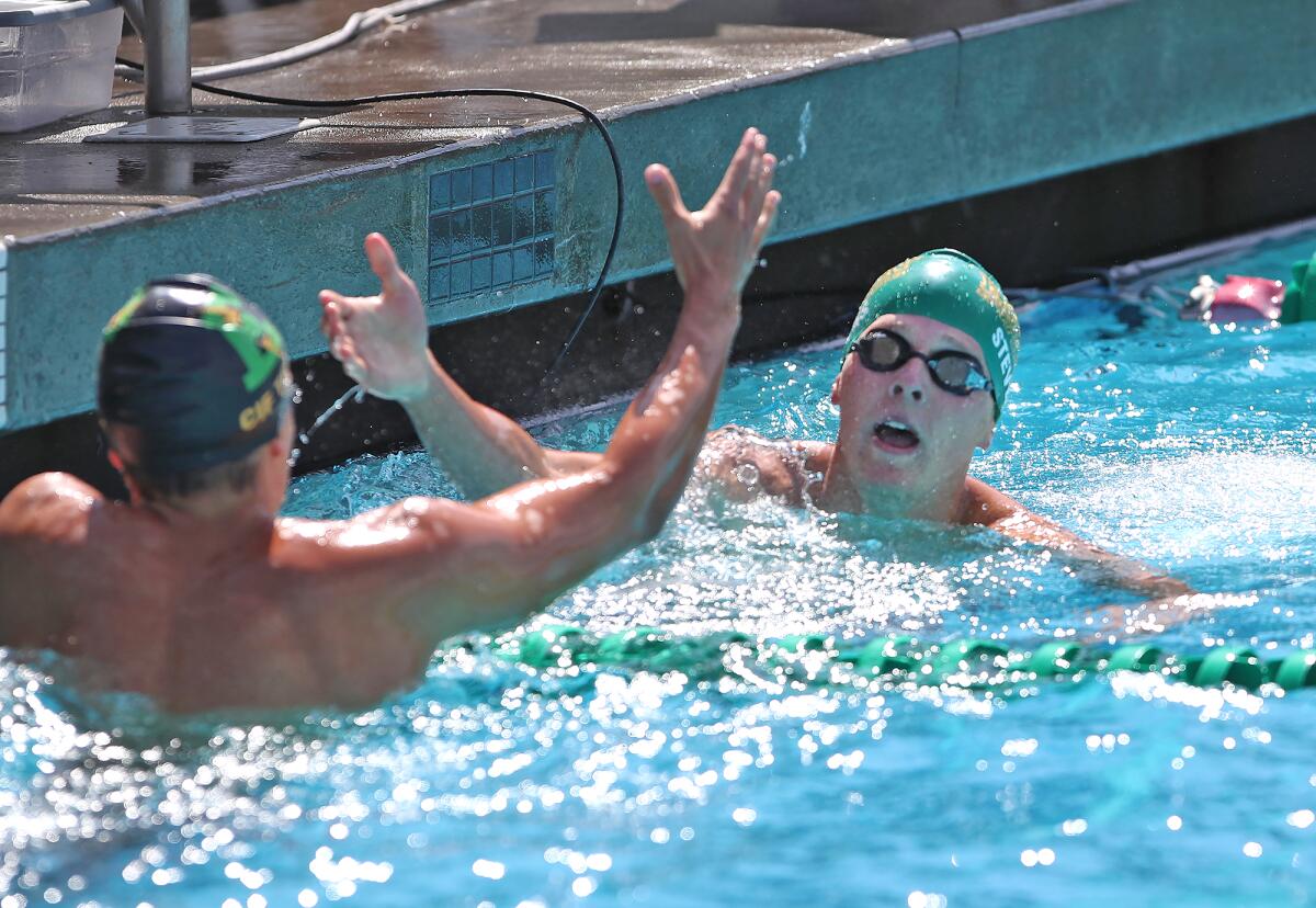 Edison's Chase Purvis and Ryder Stevens, from left, finish one and two respectively after swimming the 200-yar IM 200.