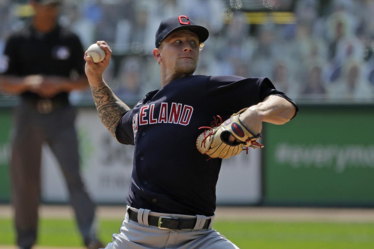 Cleveland Indians starting pitcher Zach Plesac throws against the Chicago White Sox.
